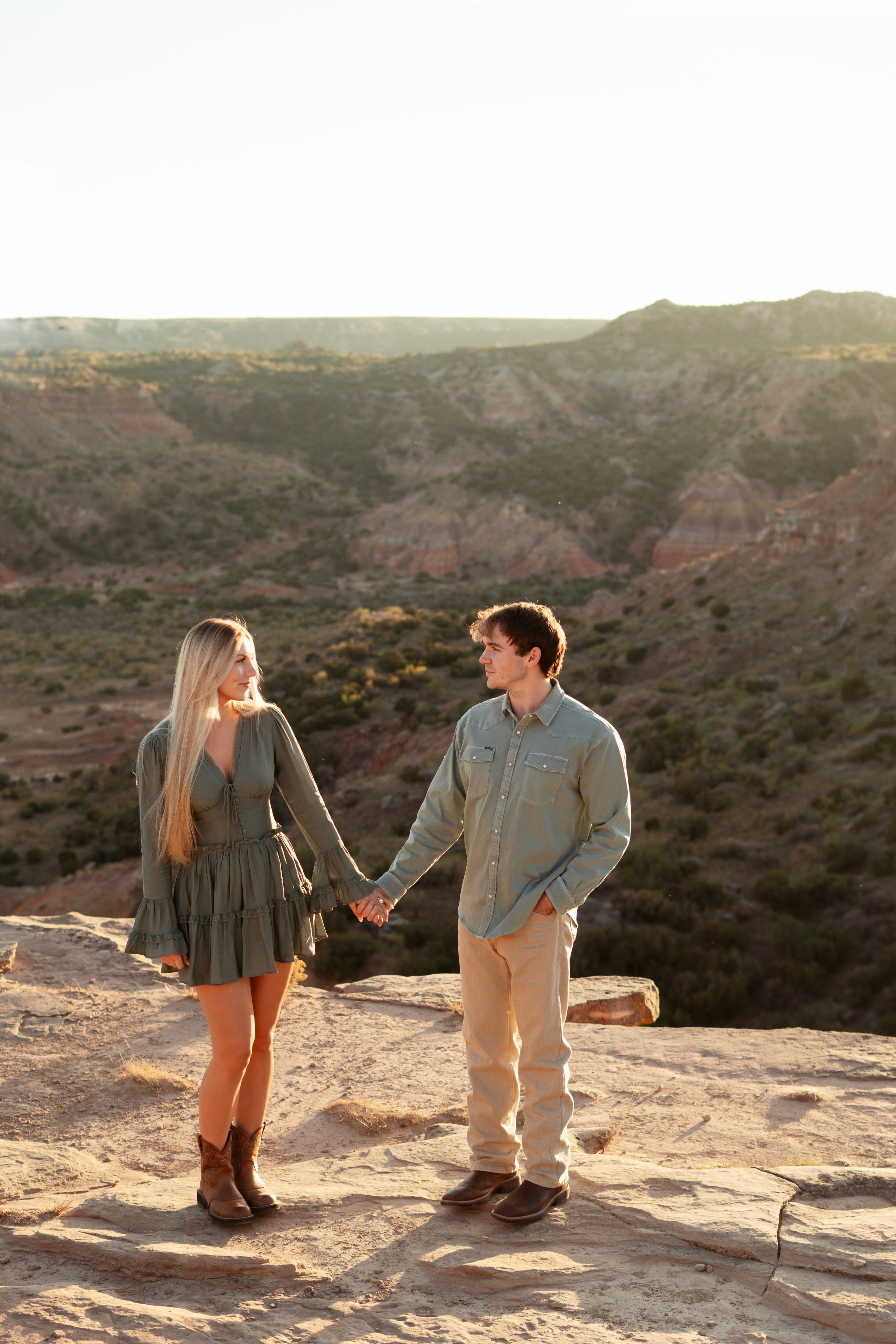 Zane and Brynne holding hands at the canyon